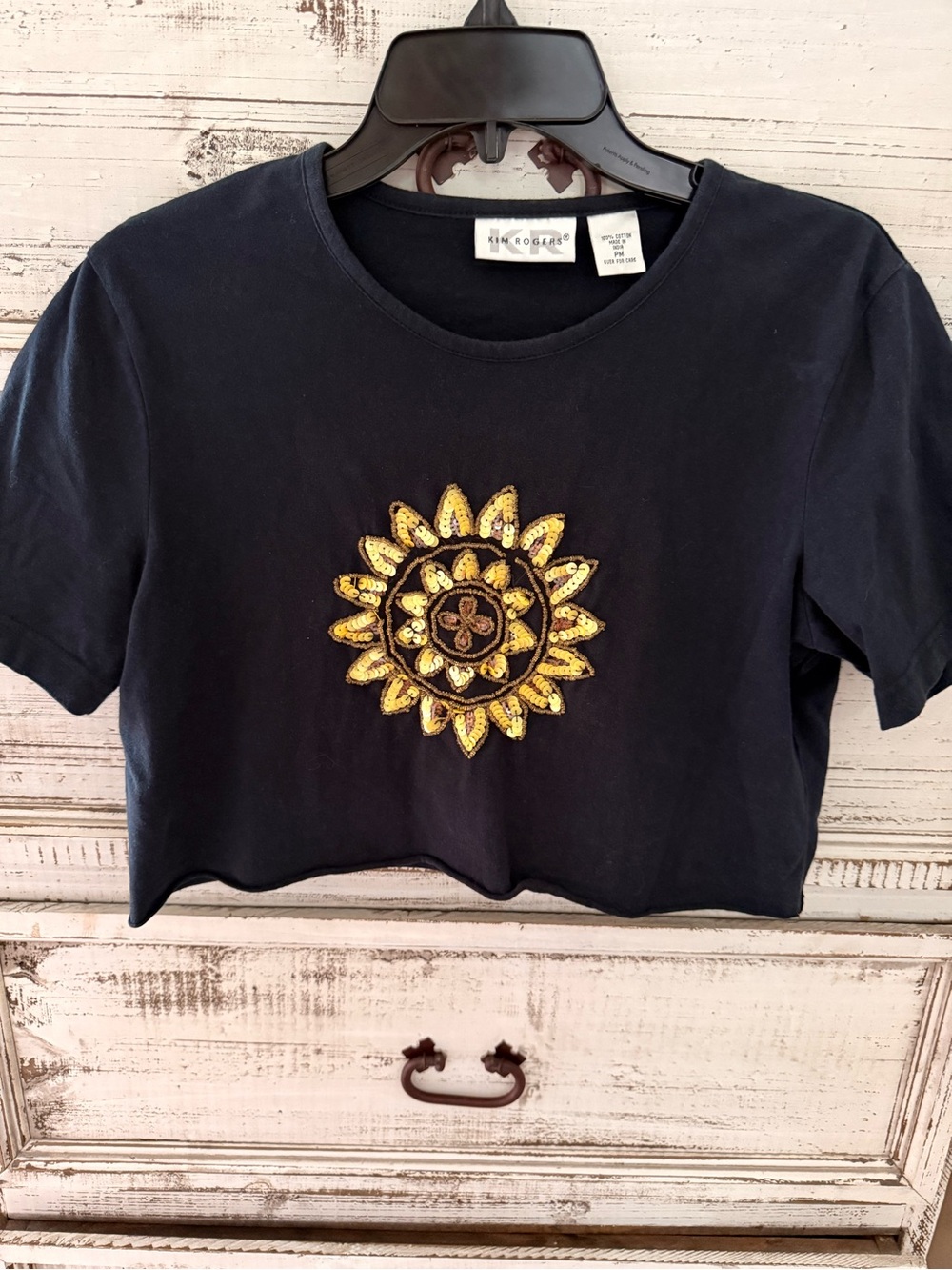 KIM ROGERS Black Cropped Tee with Gold Sunburst Patch